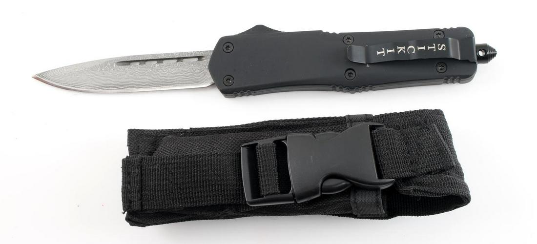 DAMASCUS STEEL AUTOMATIC SWITCHBLADE KNIFE: All metal construction Damascus steel blade automatic knife by Dennis Harris. Well crafted; spring loaded. Measures 9 inches and has a sharp 3.75 inch blade. In like new condition. Comes with cloth bu