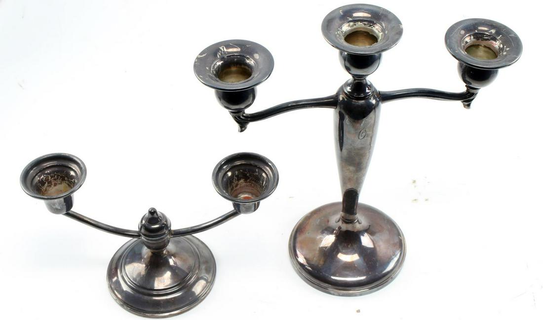 PAIR OF WEIGHTED STERLING SILVER CANDELABRA: National Silver Company sterling weighted 2 candle holder, 4 1/4"H x 7"W, and a Fisher sterling weighted 3 candle holder 8 1/2"H x 81/5"W. In good condition This lot has a reserve.
