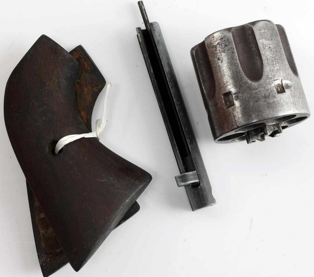 COLT SAA GRIPS CYLINDER AND EJECTION TUBE LOT: Colt SAA wooden grips, cylinder and ejection tube lot. The cylinder is showing subtle signs of wear, the ejection tube is showing signs of wear and surface patina. Overall, the lot is in very good con