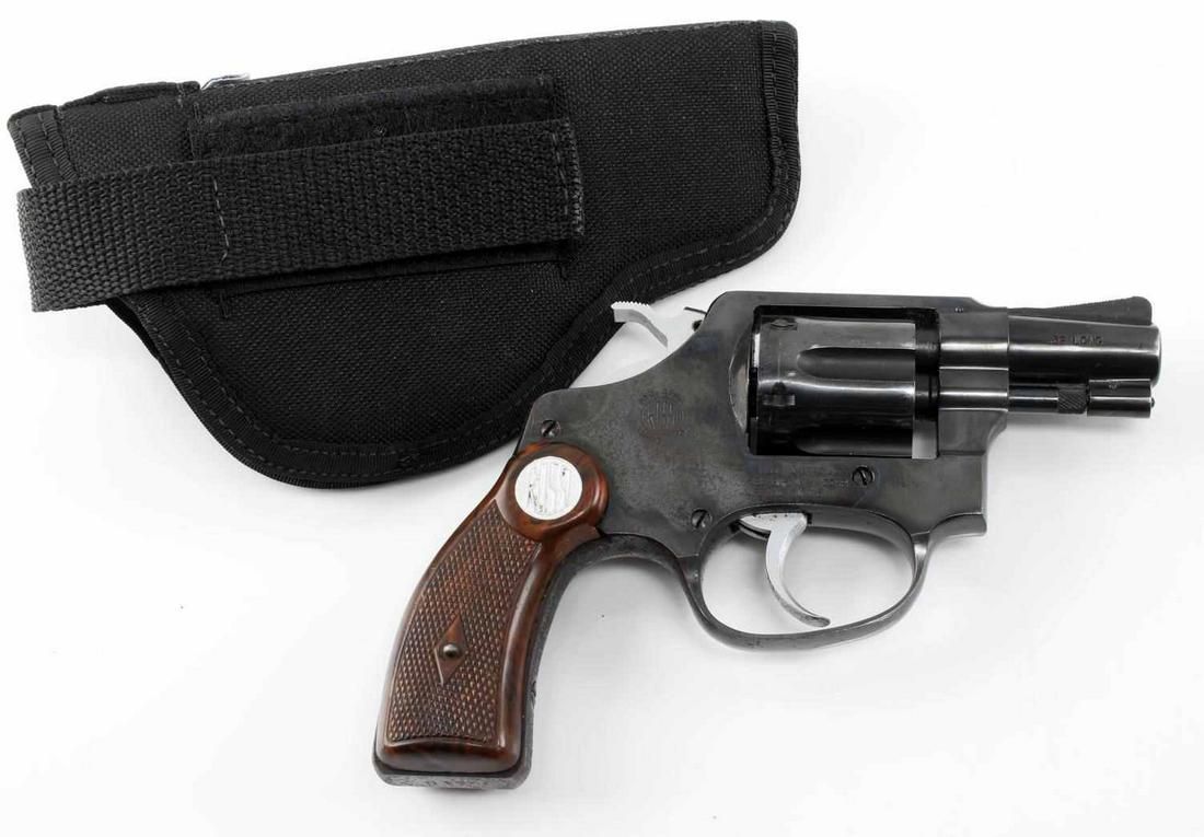 AMADEO ROSSI & CIA POCKET 6 SHOT REVOLVER .32 LONG: Blued steel, maker and import markings, .32 long caliber, barrel measures 2 inches long with good clear bore, Rossi plastic grips, serial no. to butt. Oxidation on some places. Double action is tight.