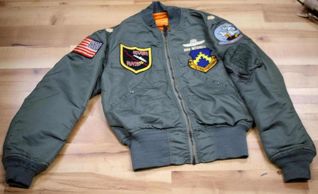 VIETNAM WAR EMBROIDERED FLIGHT JACKET SIZE SMALL: Vietnam War Embroidered Flight Jacket SZ Small. Jacket has patches of the River Rats, 8th Tactical Fighter Wing and a US flag on the right sleeve. There is mothing and rips around the collar but, this