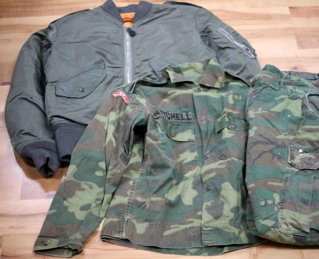 VIETNAM USAF RIPSTOP FATIGUES AND FLIGHT JACKET: USAF Vietnam War era Ripstop fatigues and Flight Jacket. The nameplate on the fatigues is Mitchell and has a Thailand badge on the right arm and an Airborne patch on the left arm. Fatigues are size Me