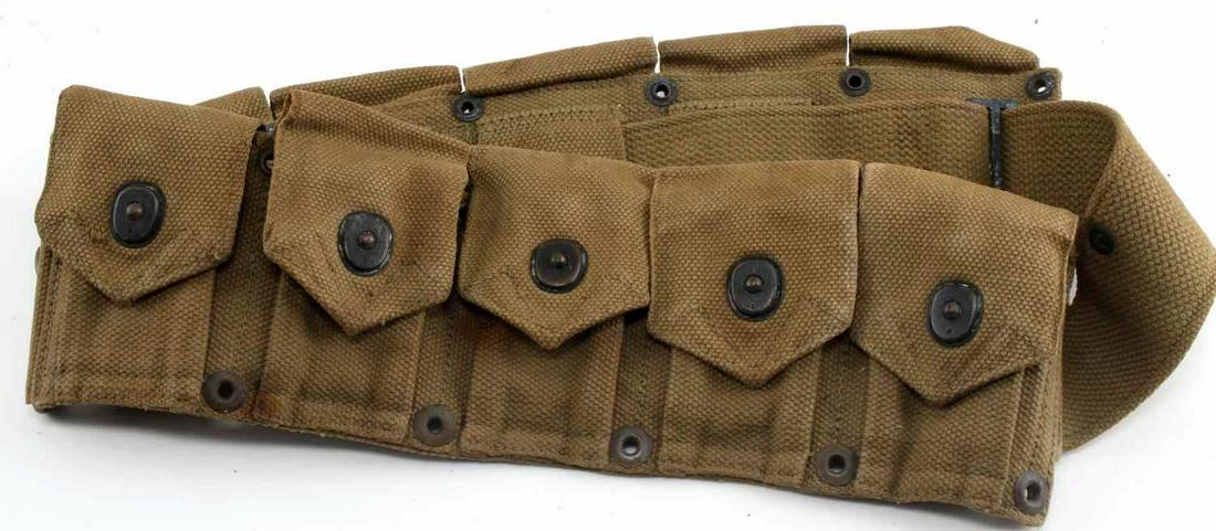 WWII US M 1923 M1 GARAND 10 POUCH CARTRIDGE BELT: US 10 Pouch M 1923 cartridge belt. 10 pouches affixed to web style belt. Very good condition overall with some buckle oxidation, two staples on first pouch on the right hand side, and a few stains pre