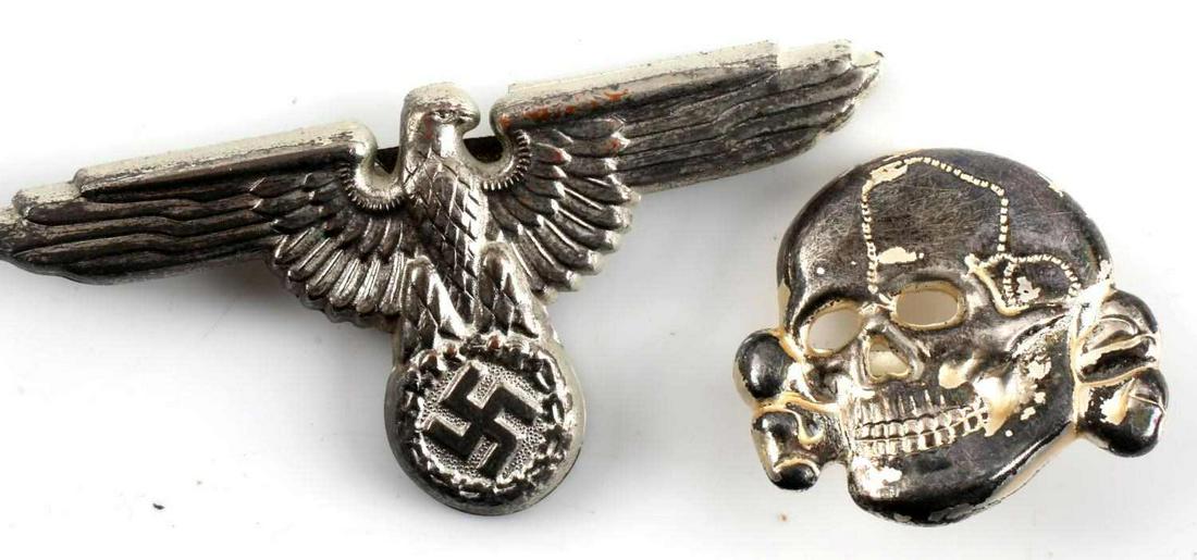 WWII GERMAN SS VISOR EAGLE AND TOTENKOPF SKULL LOT: WWII German SS Visor Eagle and Totenkopf Skull lot of two. Lot includes one SS Visor Eagle and one Totenkopf Skull. Both badges have a makers mark of RZM and M1/52. The eagle and the skull both have s
