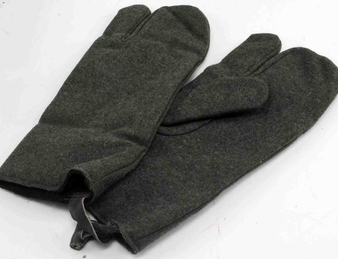 WWII GERMAN THIRD REICH SS WOOL WINTER GLOVES: Pair of WWII German Wehrmacht wool winter gloves in good condition with minimal staining and some wear on leather clasp. Unauthenticated, sold as is.