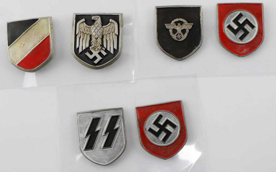 LOT OF 6 WWII GERMAN PITH HELMET SHIELDS: Lot of SIX (6) shields include three sets - SS, Army, and Border Police. Some wear. Makers marked. Unauthenticated. Sold "as is". This lot has a reserve.