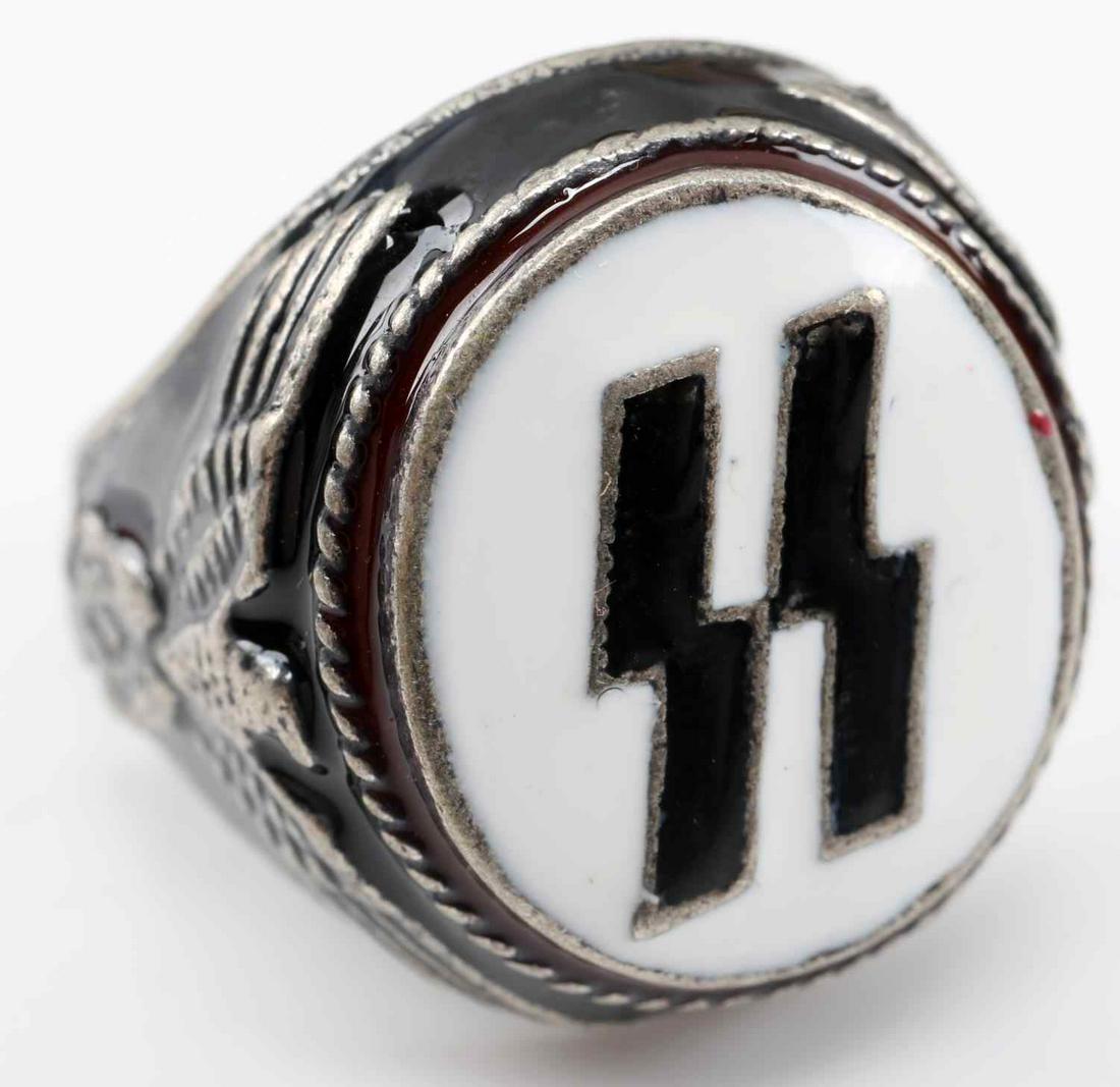 WWII GERMAN SS RUNES ENAMELED SILVER RING: WWII SS German silver ring. Marked with 800 silver and Sig runes. Black, white, and red enamel with Reichsadler relief on both sides. Size: 10 1/4 Unauthenticated, sold as is. This lot has a reserve.