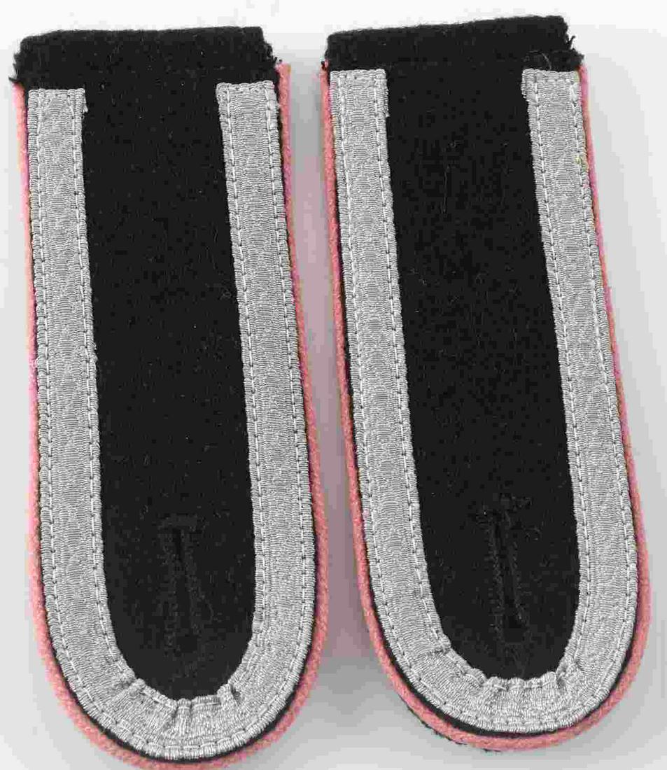 WWII GERMAN WAFFEN SS PANZER SHOULDER BOARD PAIR: German WWII Waffen SS Panzer NCO Shoulder Boards. They measure 1 3/4” wide by 8 1/2" long. The body is black wool with flat silver bullion wire tress around the edge. Has pink piping signifying the 