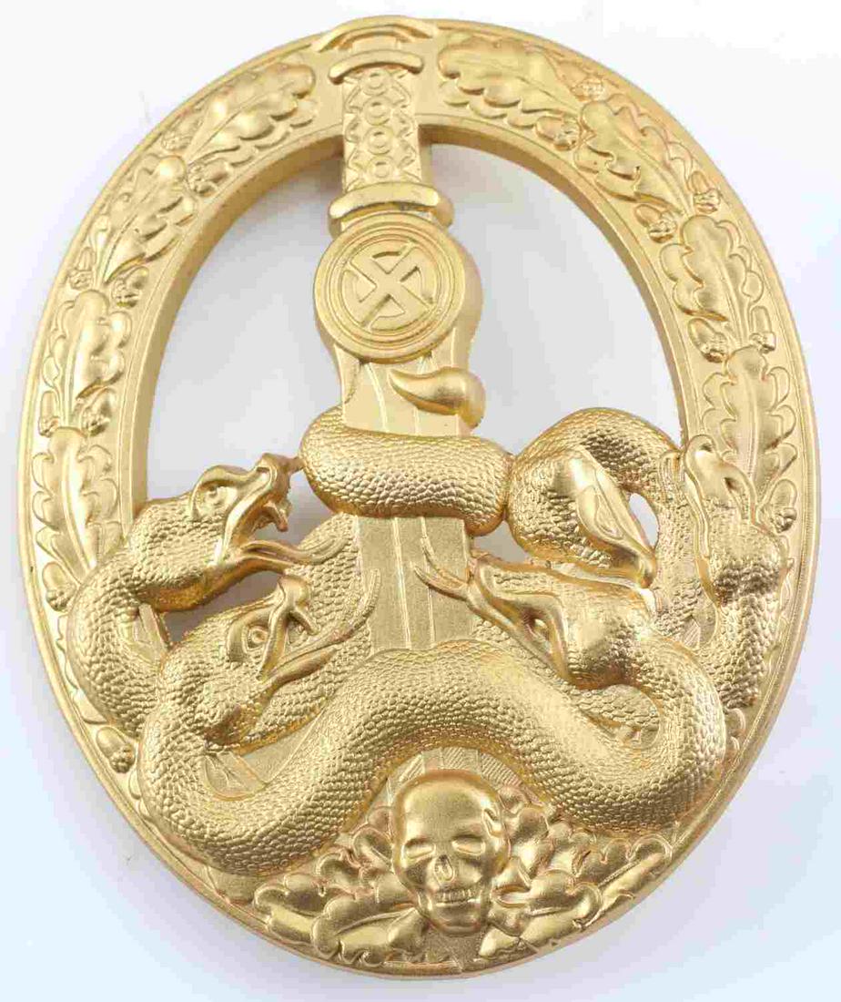 WWII GERMAN SS ARMY HEER GOLD ANTIPARTISAN BADGE: German WWII Army Heer Gold Anti Partisan Badge. The front shows five snakes on the lower part wrapped around a sword blade with a skull at the base. All six are surrounded by an oval oak leaf wreath.