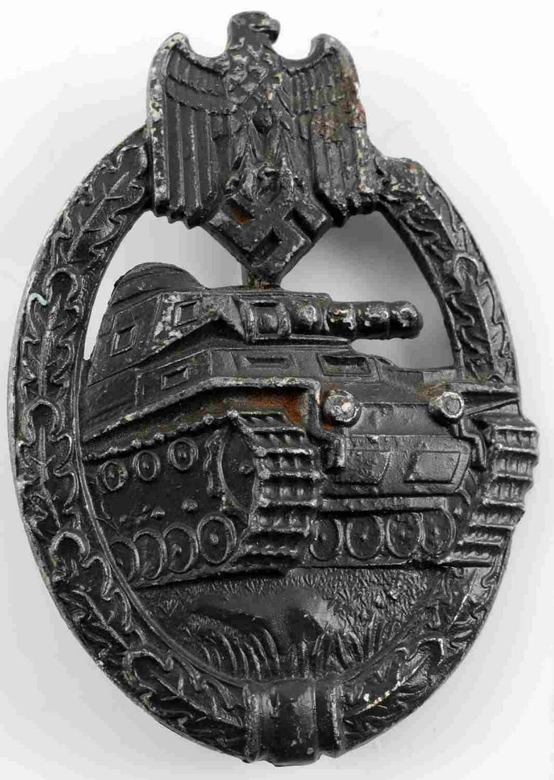 WWII GERMAN SS WEHRMACHT SILVER TANK ASSAULT BADGE: German WWII Army Silver Tank Assault Badge. The front shows a tank in the center with an army eagle clutching a swastika in his talons at the top. Both are surrounded by an oval oak leaf wreath. Has a