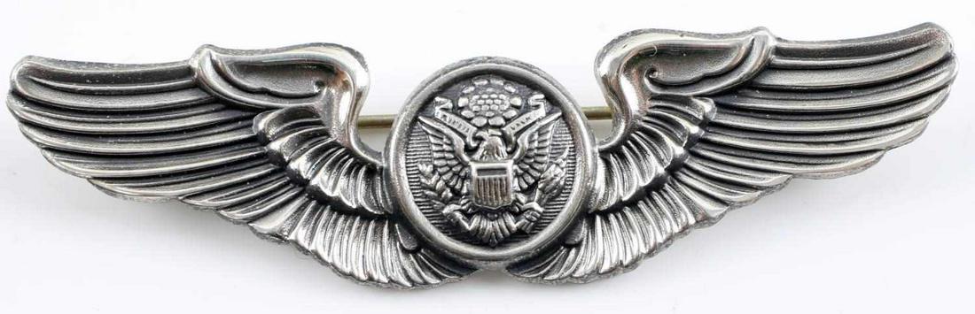 USAAF WWII ARMY AIR FORCE CREW MEMBER WING: USAAF WWII Army Air Force Air Crew Member Wing - Sterling. Measures 3 inches wide by 13/16 inches tall. The front shows an American eagle in the center flanked by a wing on each side. The reverse side