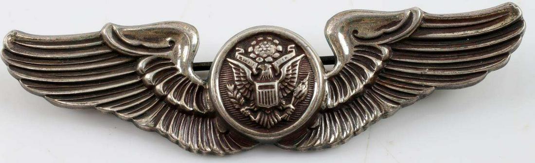 WWII UNITED STATES USAAF AIR CREW MEMBER WING: USAAF WWII Army Air Force Air Crew Member Wing - Sterling. Measures 3” inches wide by 13/16” inches tall. The front shows an American eagle in the center flanked by a wing on each side. The revers