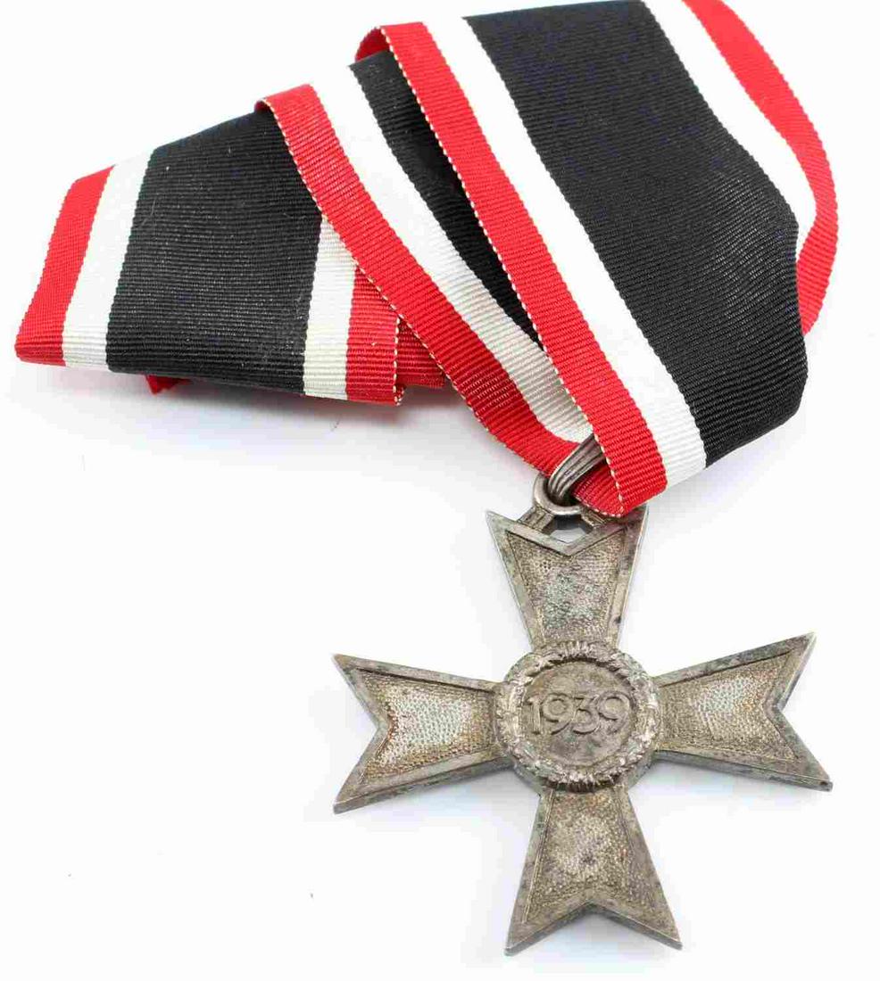 WWII GERMAN KNIGHTS CROSS TO THE WAR MERIT CROSS: German WWII Knights Cross to the War Merit Cross Without Swords. Measures 2 1/16” inches wide by 2 5/16” inches tall. The front shows a swastika in the center of a Maltese cross. The reverse side 