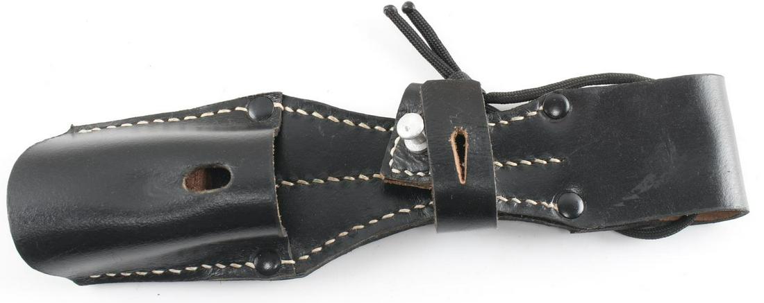 WWII THIRD REICH K 98 COMBAT BAYONET FROG: German WWII Army K-98 Combat Leather Bayonet Frog. Measures 2.5 inches wide by 9 11/16 inches tall. The reverse side is stamped with a German WWII Waffen ampt eagle clutching a swastika in his talons 