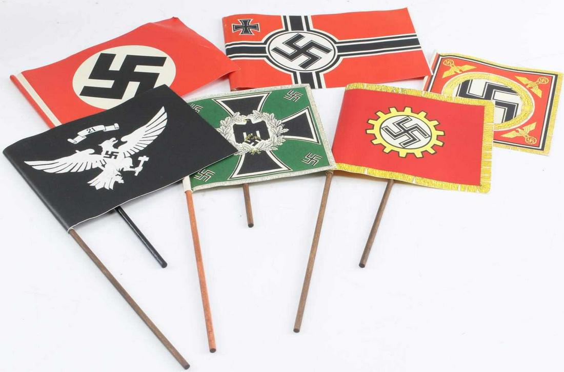WWII GERMAN MILITARY & POLITCAL RALLY PAPER FLAGS: German WWII Military & Political Rally Paper Flags. They measure approximately 5” wide by 5 3/8” tall to 7 3/4” wide by 5 3/8” tall. Includes: DAF Workers Flag; Army Mountain Troop Regimental