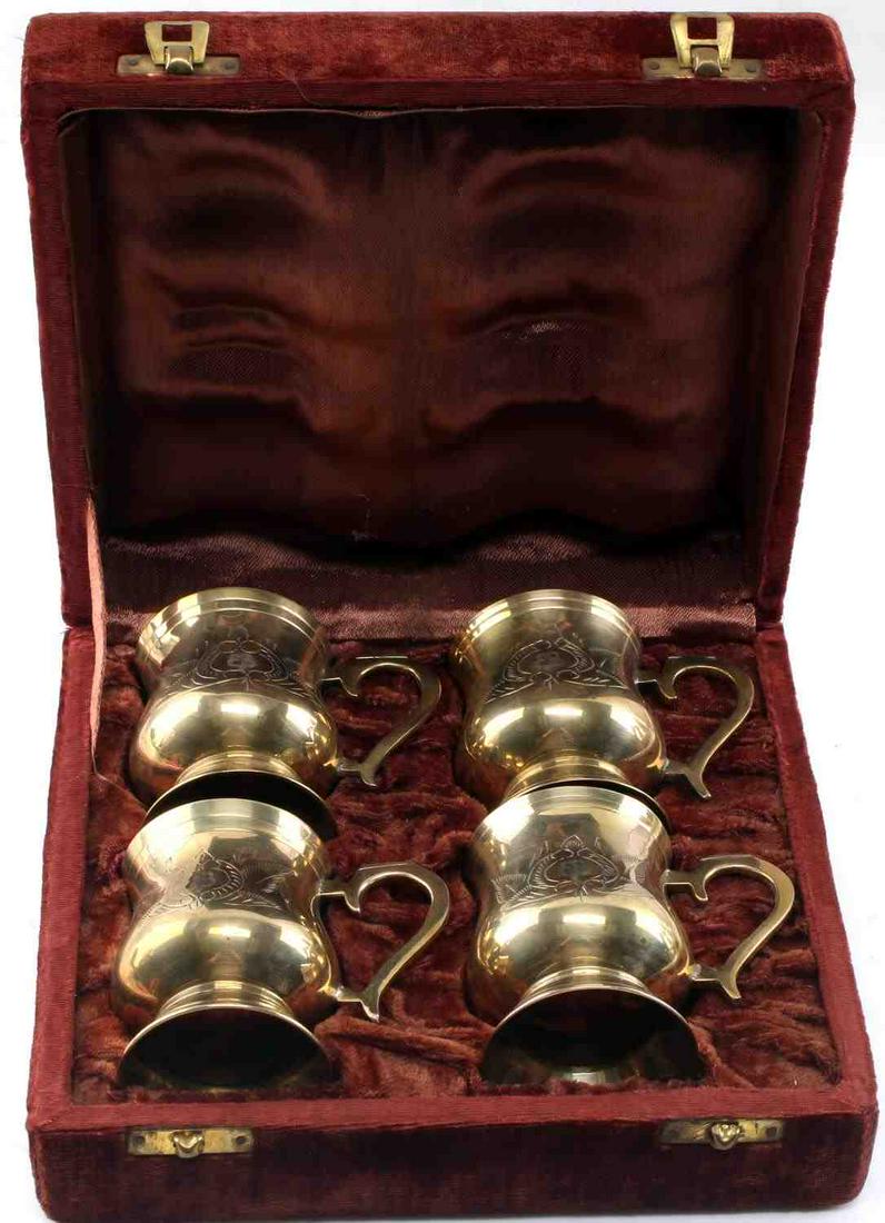 SET OF 4 EVA BRAUN EB ENGRAVED COFFEE CUPS IN BOX: Complete set of FOUR (4) coffee cups in original box believed to have been owned by Eva Braun. Approximate cup dimensions: 3 x 2.25 inches. "EB" engraved onto both sides of each cup. All in very good 