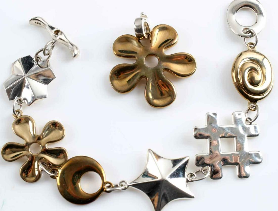 RLM ROBERT LEE MORRIS STERLING FASHION JEWELRY: Robert Lee Morris signed sterling silver and brass fashion jewelry in excellent condition. Bracelet 7 inches, pendant 1 inch diameter.