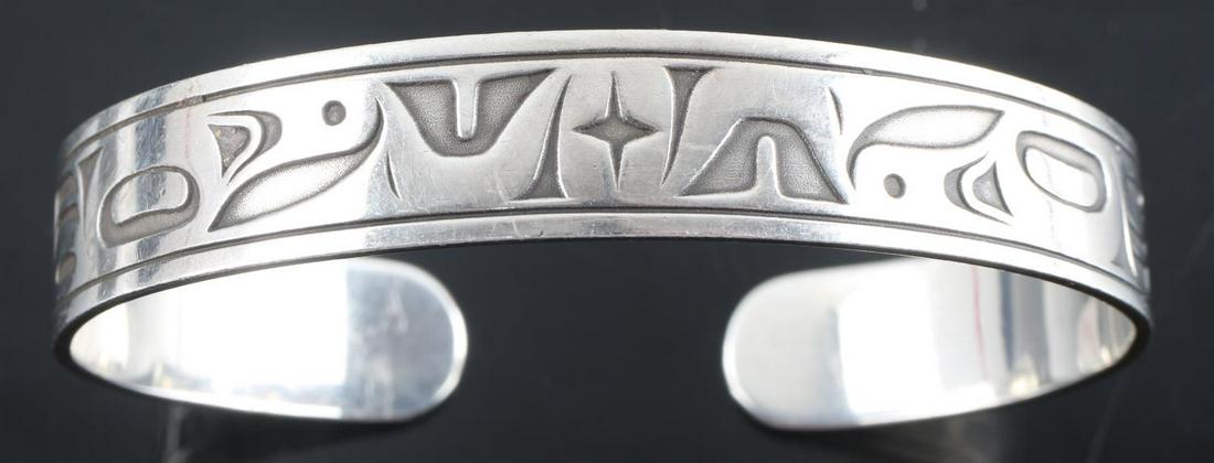 PACIFIC NORTHWEST DESIGNED STERLING SILVER CUFF: Designed by Odin Lonning, a Tlingit from Juneau, this bracelet depicts the North Star in its center. The travelers bracelet. The width of this bracelet is ½ inch, devolved length is 6¾ inches Sterli