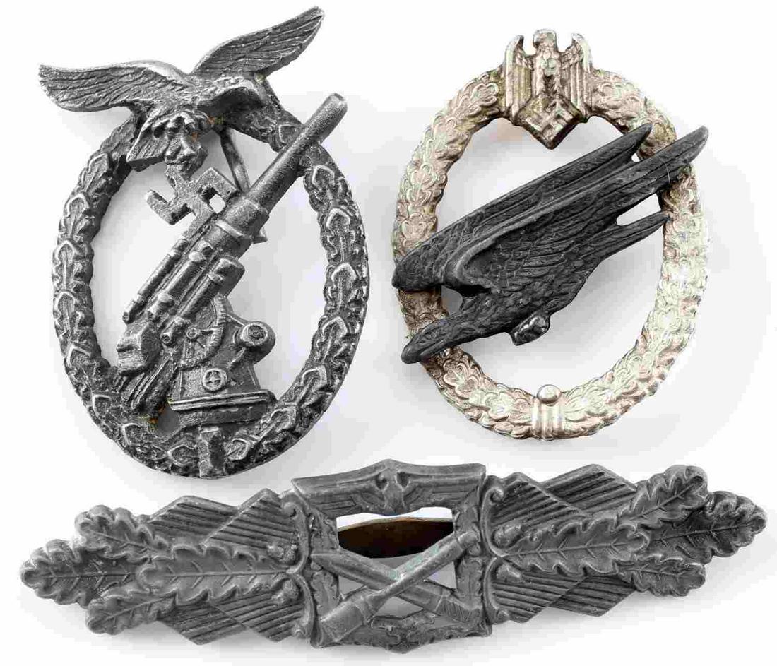 WWII GERMAN THIRD REICH LUFTWAFFE FLAK BADGE LOT: WWII German Third Reich Luftwaffe Flak Badge Lot. The Lot includes one Close Combat Clasp with a makers mark of Peekhaus Berlin, one Luftwaffe Paratrooper badge, and one Anti-Aircraft Flak Badge. The 