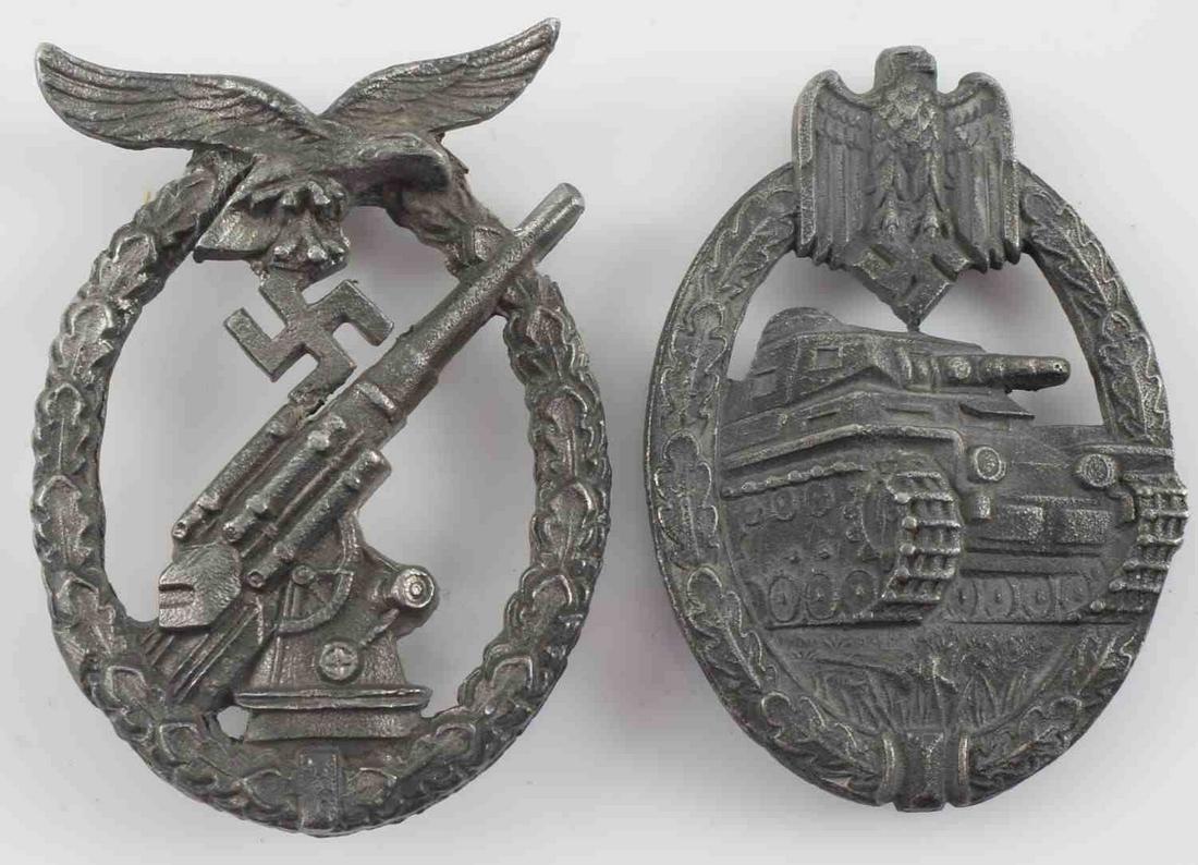 WWII GERMAN THIRD REICH LUFTWAFFE PANZER BADGE LOT: WWII German Third Reich Luftwaffe and Panzer Badge Lot. Lot includes Panzer Assault badge and Luftwaffe Anti-Aircraft Flak Artillery badge. The badges are missing the vertical pin back. The flak badge