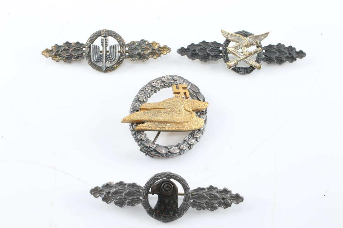WWII GERMAN THIRD REICH LUFTWAFFE BADGE LOT OF 4: WWII German Third Reich Luftwaffe Badge Lot of Four. Lot includes one Paratrooper badge, one Short Range Night Fight clasp, one Luftwaffe Recon clasp and one Transport Glider badge. The badges all hav