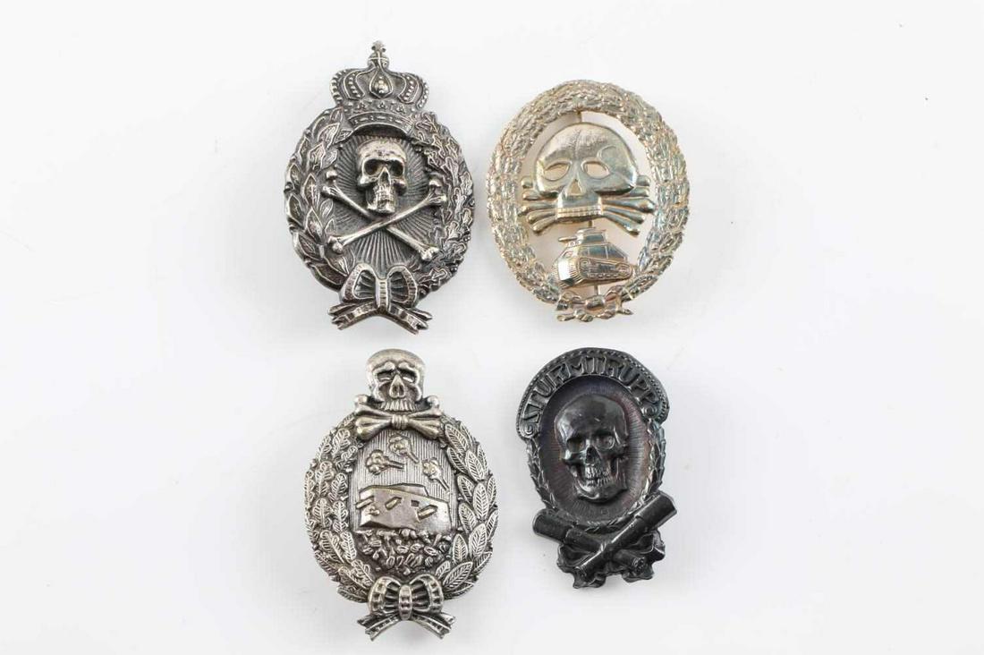 WWI IMPERIAL GERMANY PRUSSIAN TOTENKOPF BADGE LOT: WWI Imperial Germany Totenkopf Deaths Head Badge Lot of Four. Lot includes Sturmtrupp badge and Imperial Tank Badges. The badges have some pitting and finish loss. Very good condition. Unauthenticated