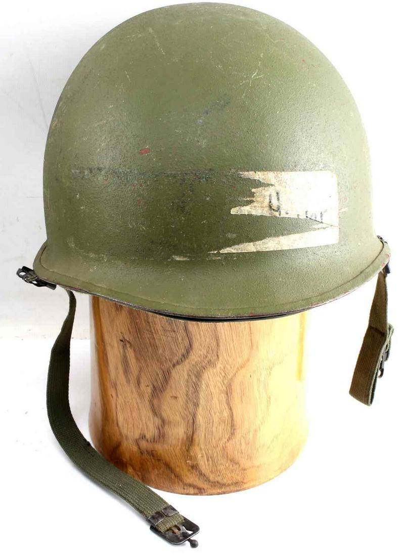 VIETNAM WAR US ARMY M1 INFANTRY HELMET: Vietnam era rear seam US Army M1 helmet. Both shell and lining appear to have been repainted. In good condition with this exception. Liner marked "Liner Helmet, Ground Troops Type 1."