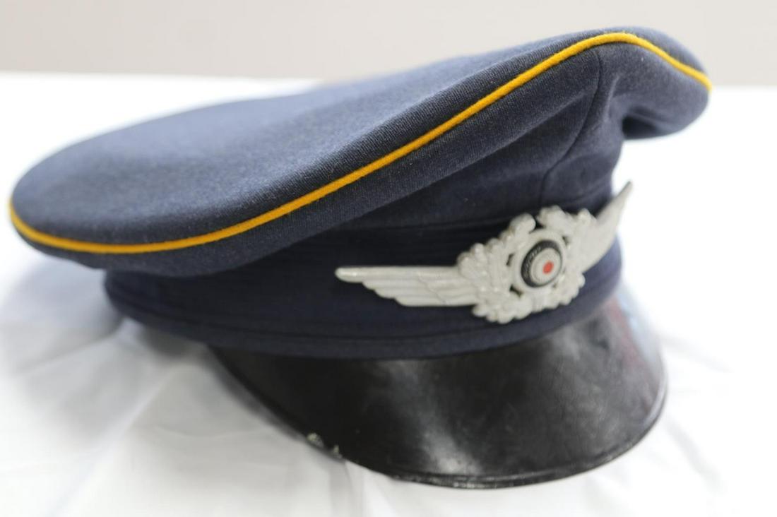 REENACTORS WWII GERMAN LUFTWAFFE VISOR CAP: Reenactors German Luftwaffe visor cap with signal corps yellow piping. Well constructed with leather sweatband and silk interior. Has cockade affixed to front but is missing Luftwaffe adler. Good homa