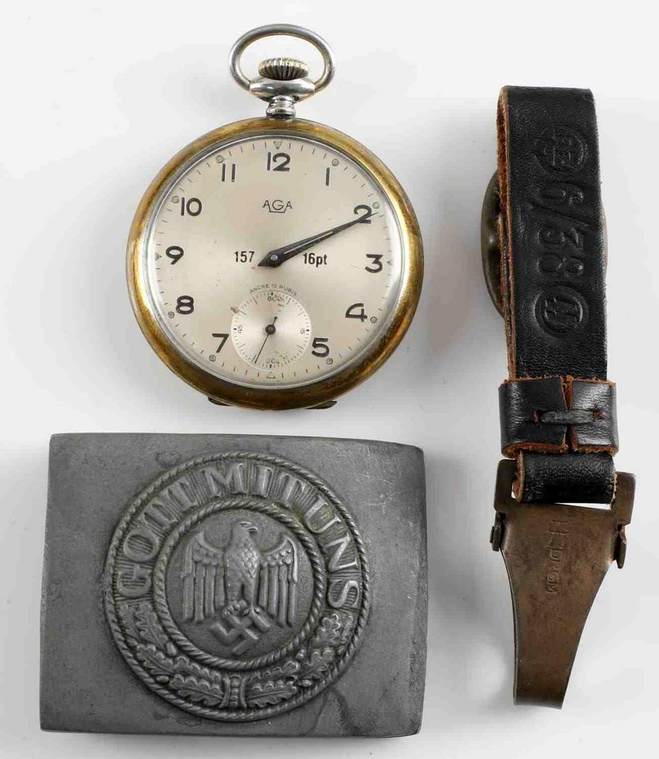 WWII THIRD REICH POCKET WATCH DAGGER HANGER BUCKLE: One "3rd SS Panzer Division Totenkopf" pocket watch measuring 1.75 inches by 1.75 inches and stamped with words "Ehre- Treue-Tapferkeit" under skull. Watch shows some tarnishing and is untested. One s