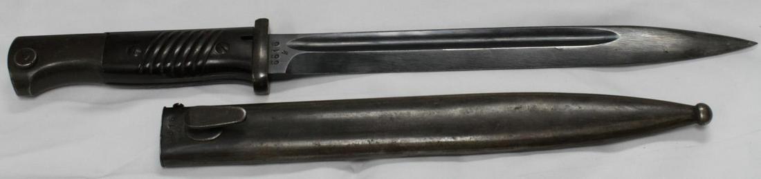 WWII GERMAN THIRD REICH MATCHING BAYONET 1942: WWII model Matching bayonet and scabbard with matching numbers. Serial number "6616" stamped on blade and scabbard. "42 CVL" stamped on base of blade and reverse side of scabbard. Made of rolled steel