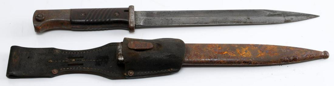 WWII GERMAN K98 BAYONET MAUSER FW HOLLER: K98 Bayonet by F.W. Holler of Soligen, Germany. Pommel to tip of blade is 15.25 inches. Scabbard length is 16.25 inches. Number on blade is 773 f with matching number 773 on scabbard. Heavy rusting on