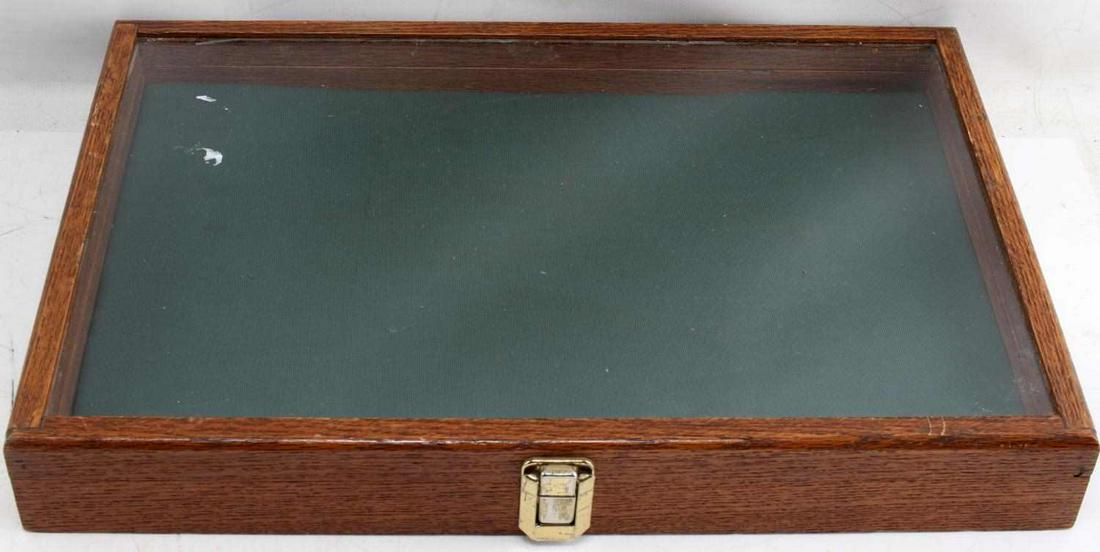 WOODEN DISPLAY CASE FOR ARTIFACTS AND SUCH: Glass top wooden case with foam interior and brass closure. Measures 18.5 X 12.5 X 2.5 inches. Good condition.