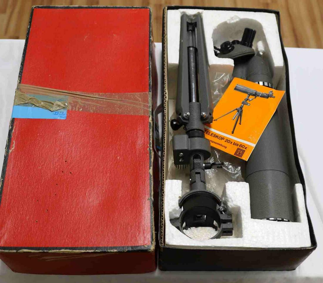 VINTAGE GERMAN FOTO QUELLE TELESCOPE TRIPOD 20 X: One dark-grey colored, zoom spotting telescope 20X by 60X made in Germany in the 1960s or 1970s, and sold by the Foto-Quelle, GmbH catalogue order company. Telescope measures 15 inches in length and 2