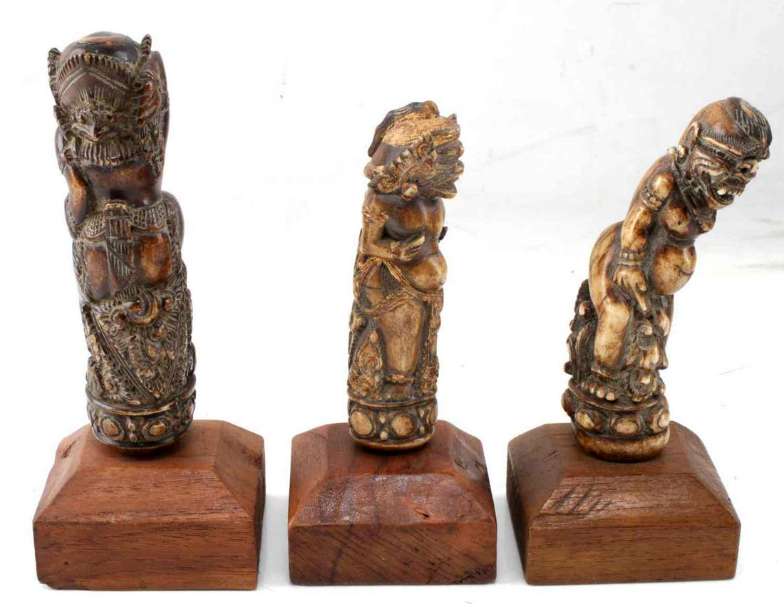 ANTIQUE HINDU BUDDHIST DEMON BONE CARVINGS LOT 3: Antique Hindu/Buddhist Demon Bone Statue Carvings lot 3. Includes display stand. One believed to be Rakshasa statue Measure 4.5 inches high. 6.5 inches with stand. One smaller believed to be Rakshasa 