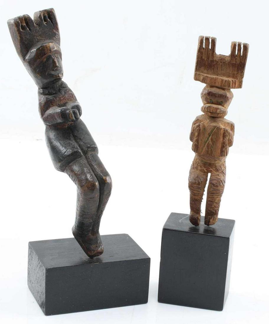 TRADITIONAL WOOD CARVED MAYAN SLINGSHOTS LOT 2: Traditional Mayan wood carved slingshots lot 2. Does not include strap. Both are mounted. One appears to be a monkey 5.5 inched tall, 8 inches with mount. Other appears to be a person. 7 inches tall, 