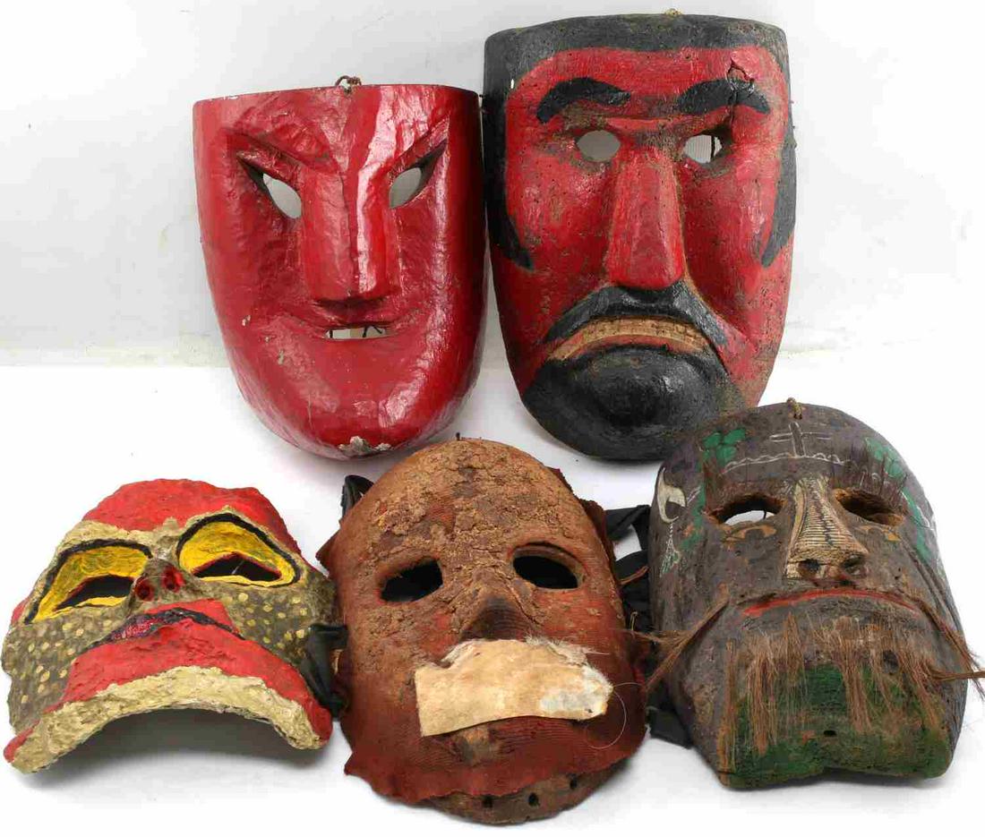 LOT OF 5 LATIN AMERICAN WOODEN MASKS AND MORE: One red painted with slanted eyes, one black and red with frowning face, one with cloth and covered mouth, one paper mache brightly painted, and one, maybe Mexican, with painted design and hair. Good 