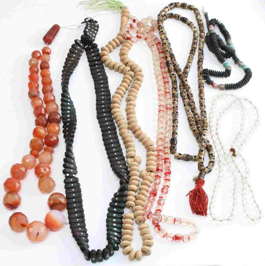ANTIQUE VINTAGE PRAYER BEAD LOT W CHINESE SKULL: Tasseled, sandlewood, antique Chinese carved skull from bone, glass, seed, honeycombed hematite quartz.