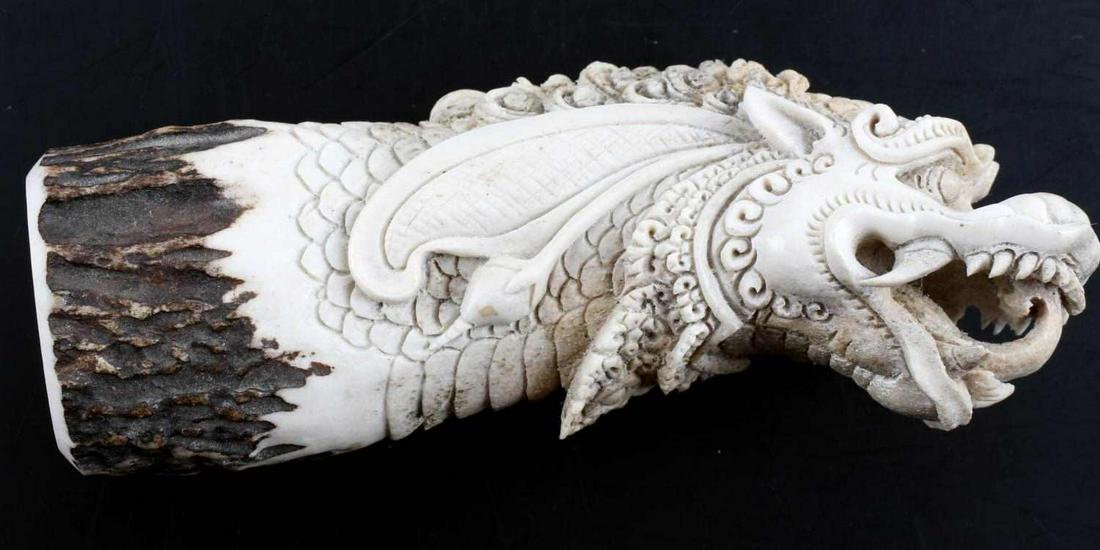 INTRICATE CARVED STAG KNIFE OR CANE HANDLE DRAGON: Superbly crafted handle for blade or perhaps cane, it measures 210 mm with a hole measuring 17mm with a depth of 150mm tapering at the bottom. A true work of art.