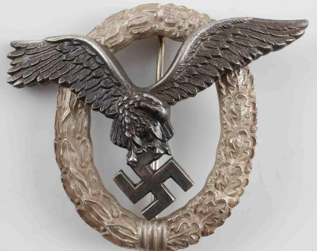WWII GERMAN THIRD REICH LUFTWAFFE PILOT BADGE: WWII German Third Reich Luftwaffe Pilot Badge. Presentation model from 1943. Made from 800 silver and marked "C.E. Junker Berlin SW". Engraved to "Lt. GerdBernhardt 27.06.1943". Vertical pin back with