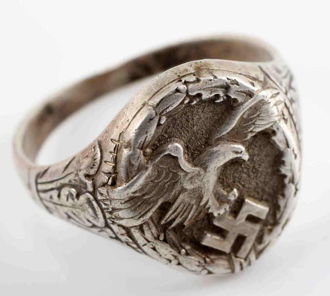 WWII GERMAN LUFTWAFFE PILOT OBSERVER SILVER RING: Genuine WWII German Luftwaffe pilot observer ring. Ring is in 800 Silver. The ring is a size 11. There is some surface patina found on the ring. Very good original condition. This lot has a reserve.