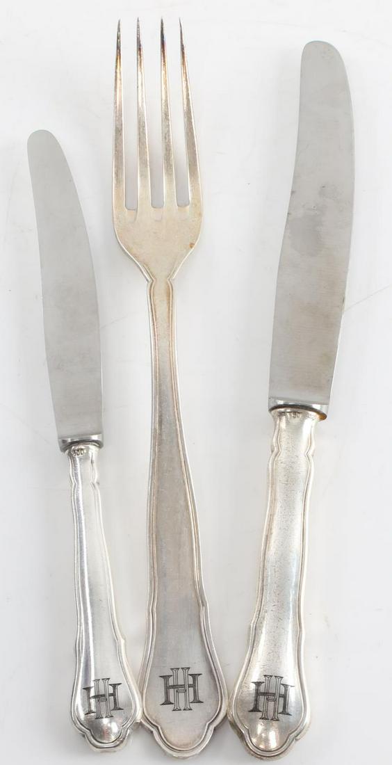 3 WWII GERMAN SS HIMMLER SILVER DINNERWARE LOT: 3 pieces of Heinrich Himmler silver dinnerware. 2 knives, 1 fork, all stamped with "HH" on handle. Knives stamped "ROSTFREI" on blade and "900" on handle. Fork stamped 800 and makers mark. Unauthentic