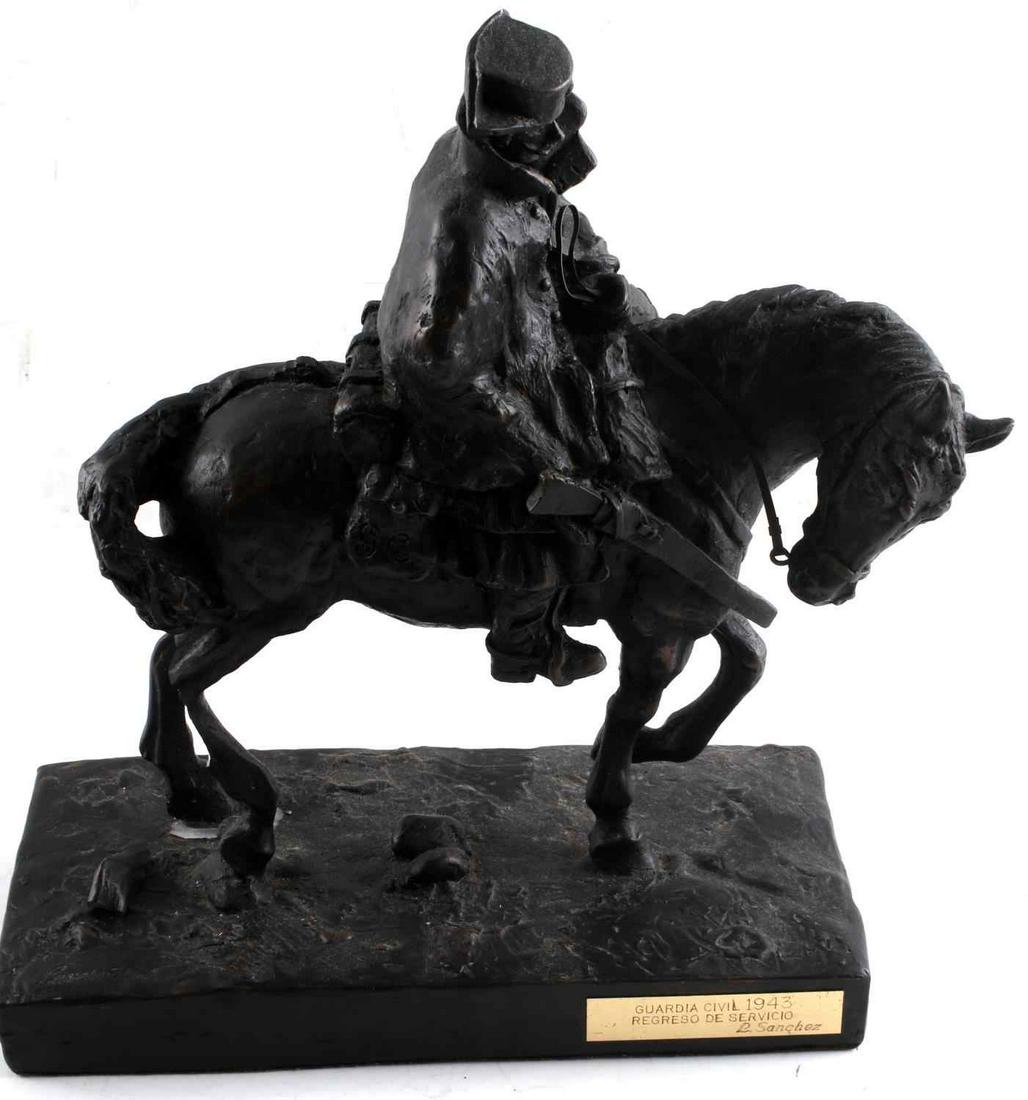 LUIS SANCHEZ GUARDIA CIVIL 1943 STATUE: Luis Sanchez Guardia Civil Regreso de Servicio Statue. The statue is composed of plaster. "23" is stamped on the rear of the base. "Propiedad de Luis Sanchez" stamped on left side of the base with bra