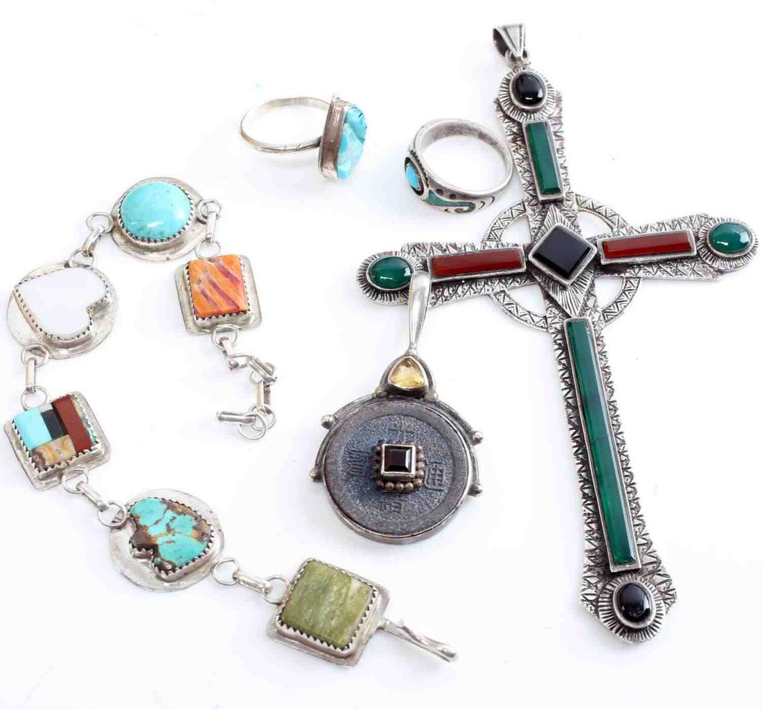 LOT OF SIX PIECES STERLING SILVER JEWELRY RING: One Native American/Southwest style bracelet marked "NC" One Desert Rose Trading turquoise and opal ring size 8. One ring with turquoise size 7. Citrine and garnet Sajen pendant measuring 2 inches. La