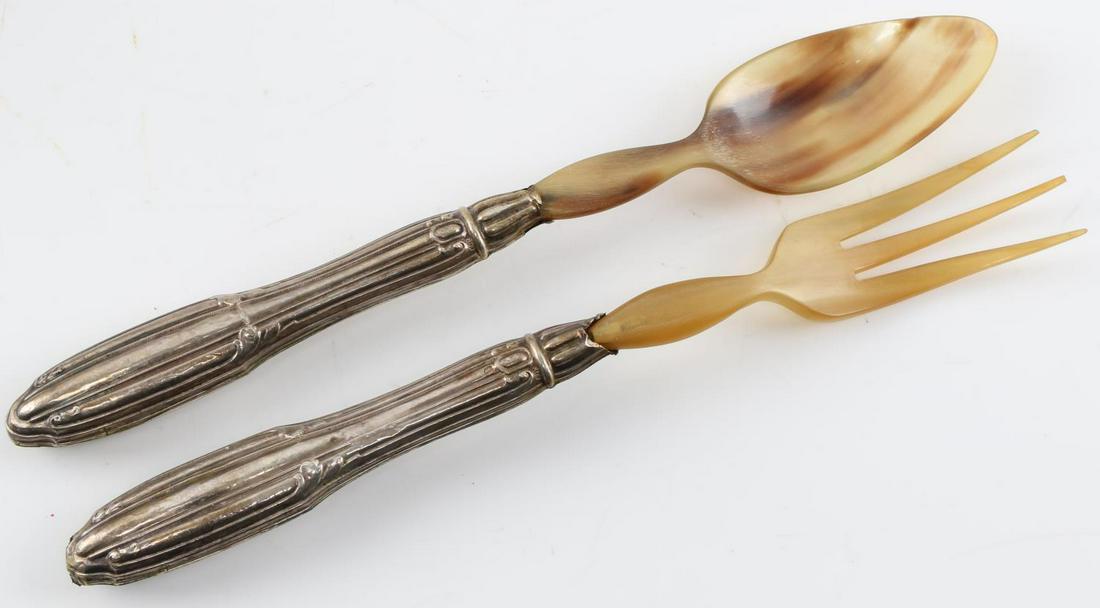 ANTIQUE EUROPEAN 800 SILVER AND HORN SERVING SET: Hallmarked 800, weight handle with horn fork and spoon top. some loss at conjunction of shoulder and stem on each. Fork loose at said conjunction. Length 25cm each