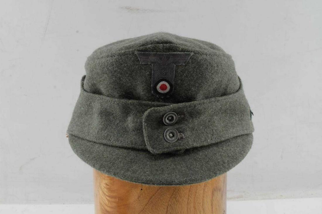 WWII GERMAN THIRD REICH MOUTAIN TROOP M43 CAP: WWII German Third Reich Mountain Troop M43 Cap. The cap has the Edelweiss on the left side. The cap is a size 57. "Robert Klein Wasserfurt HANDARBEIT" is stamped on the inside. Very good condition. Un