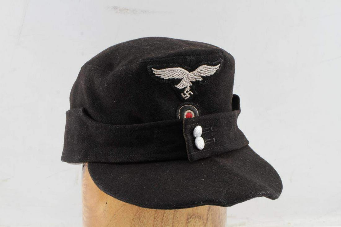 WWII GERMAN THIRD REICH LUFTWAFFE M43 CAP: WWII German Third Reich Luftwaffe M43 Cap. The cap is a size 57. The cap is stamped on the inside. There is a small tear (measuring approximately an inch) on the inside of the cap. Does not fluoresce.