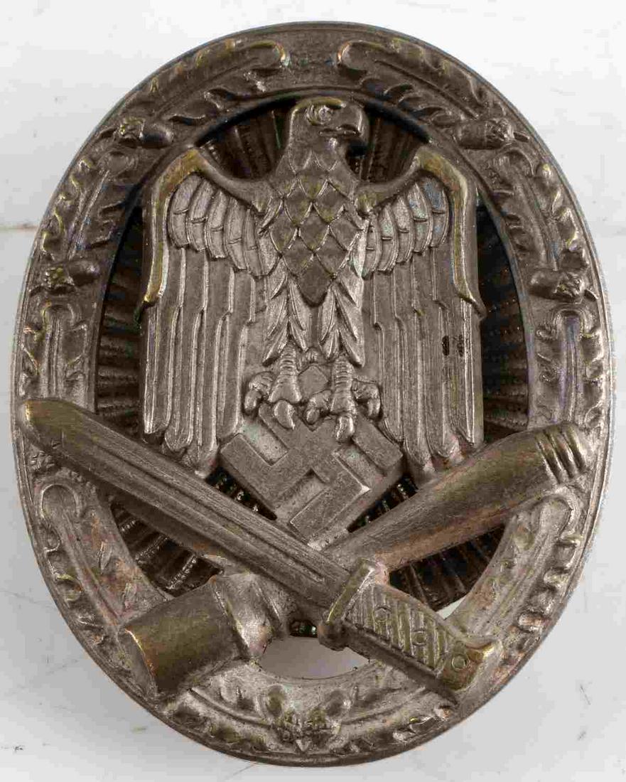 WWII GERMAN THIRD REICH SS GENERAL ASSAULT BADGE: German WWII Army General Assault Badge. The front shows a German eagle clutching a swastika in his talons in the center with a crossed bayonet & potato masher stick grenade at the base. All three are 