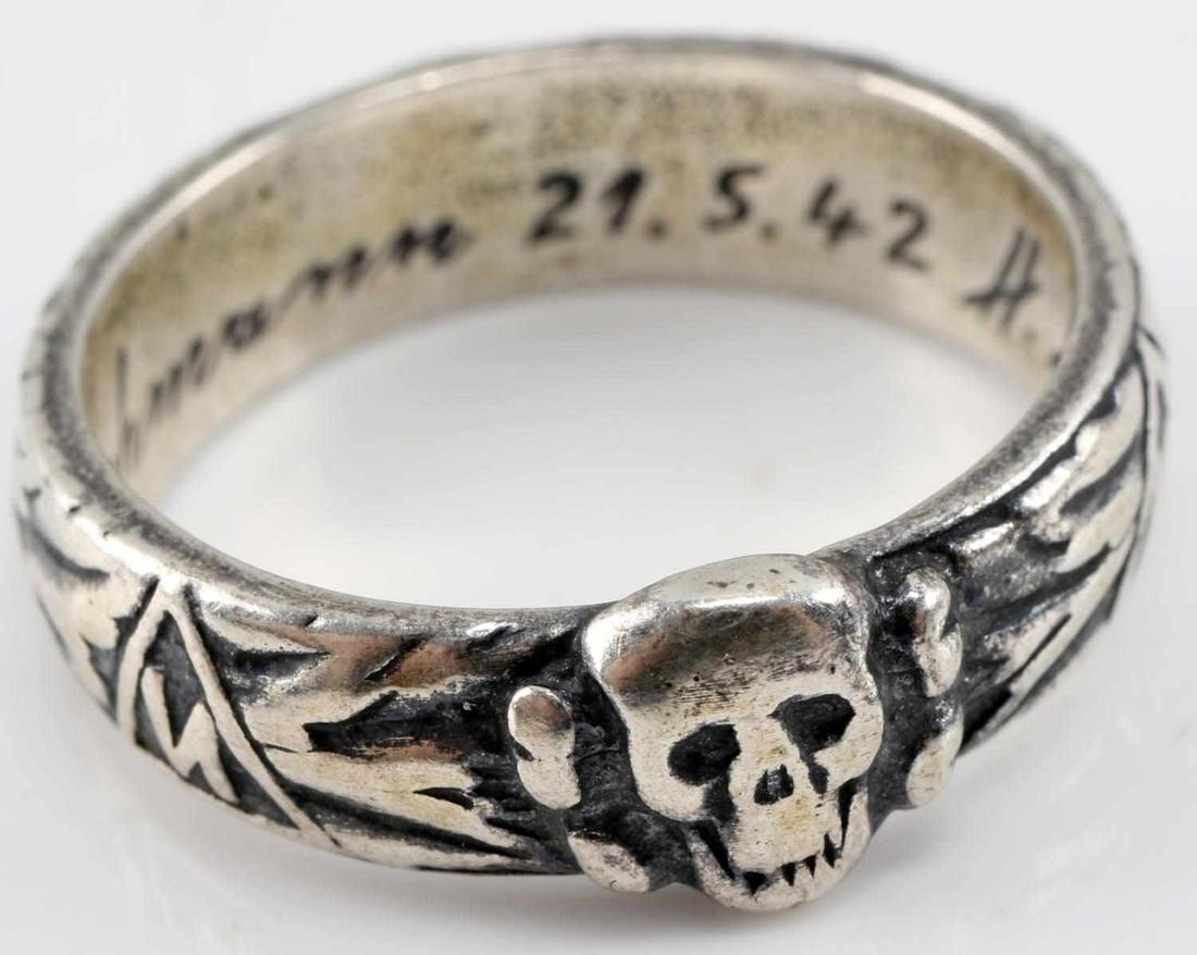 WWII GERMAN WAFFEN SS TOTENKOPF OFFICER HONOR RING: WWII German Waffen SS Totenkopf Officer Honor Ring. Measures .75 inches in diameter. The inside is engraved "S. lb. Lohmann 21.5.42 H. Himmler". Ring has SS runes with Totenkopf and oak leaves around 