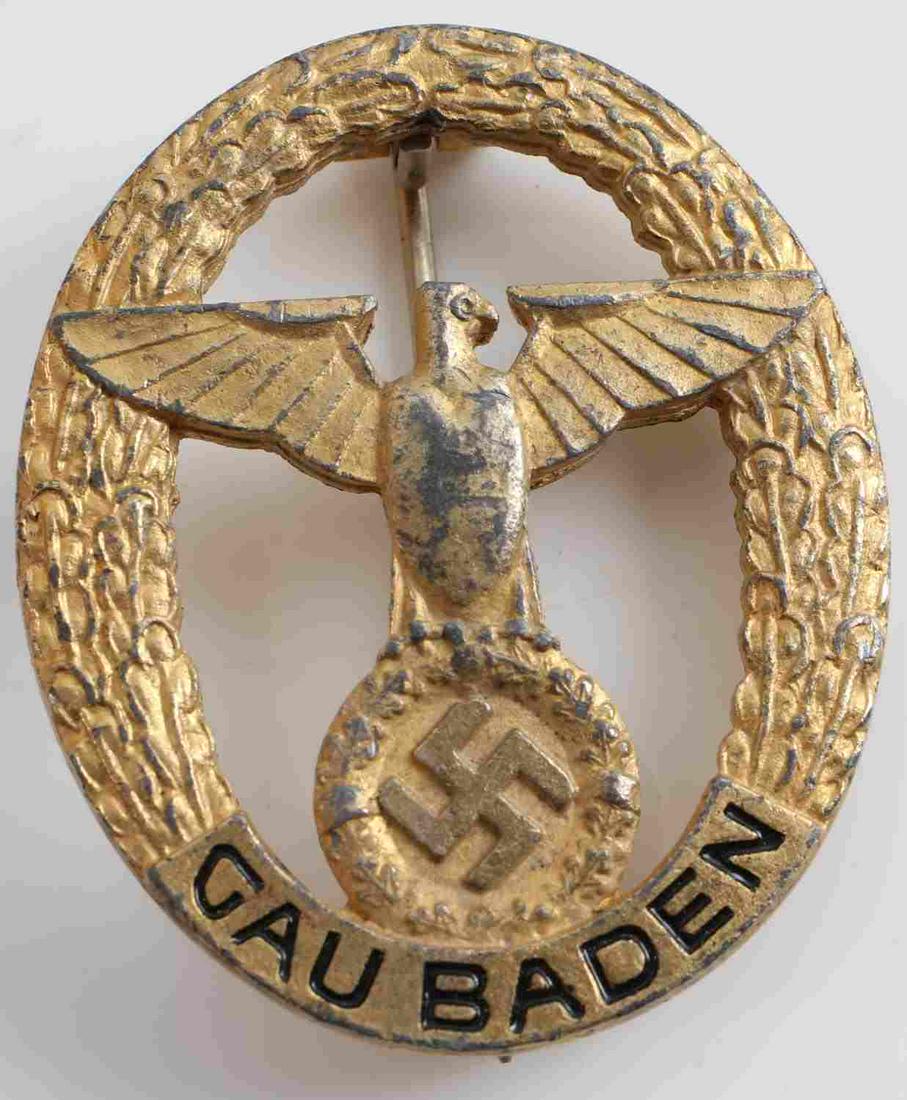 WWII GERMAN THIRD REICH NAZI GAU BADEN EAGLE BADGE: WWII German Third Reich Nazi Gau Baden badge. 2x1.5. Pin goes back 180 degrees. Maker's mark. Unauthenticated. Sold as is.