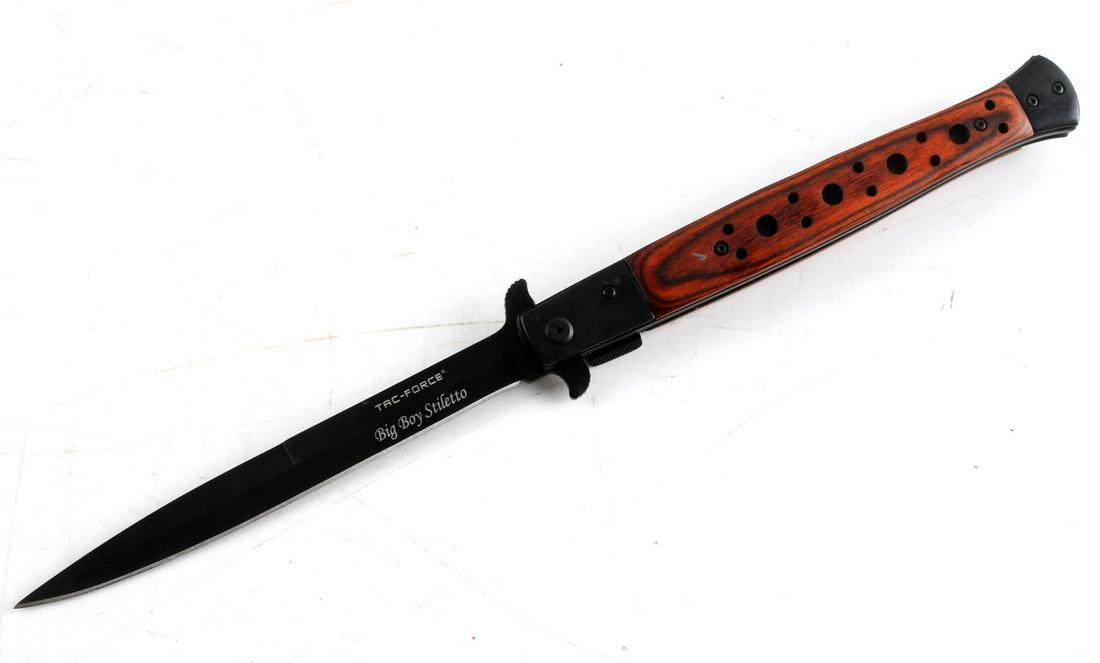 BIG BOY STILETTO TAC FORCE SWITCHBLADE REDWOOD: Big Boy Stiletto from Tac Force Switchblade. The handle is composed of a Red wood. The blade measures 6 inches, the entire knife measures 13 inches. Very good condition.